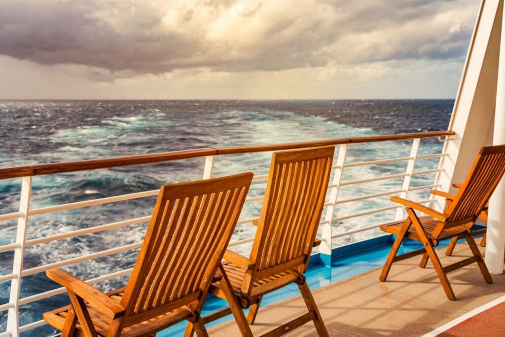 Quiet cruise ship deck overlooking the ocean, showing the relaxing experience teachers can enjoy with teacher cruise discounts.