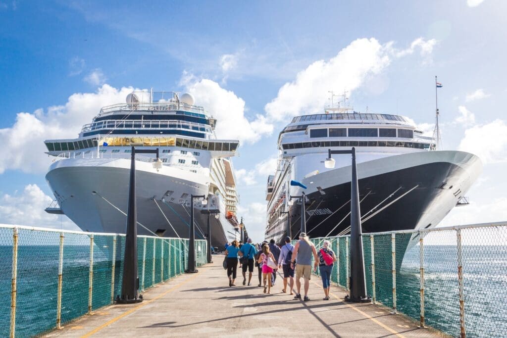Travelers boarding cruise ships at port, representing an easy and organized cruise experience for teachers.