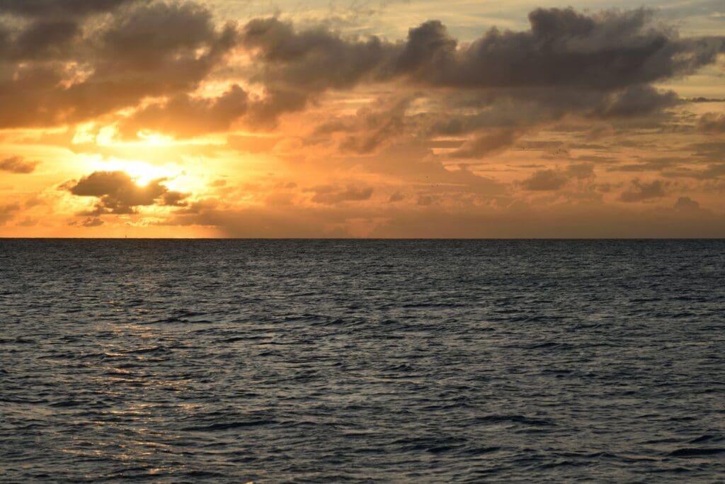 Ocean sunset viewed from a cruise, symbolizing a peaceful and restorative getaway for teachers.